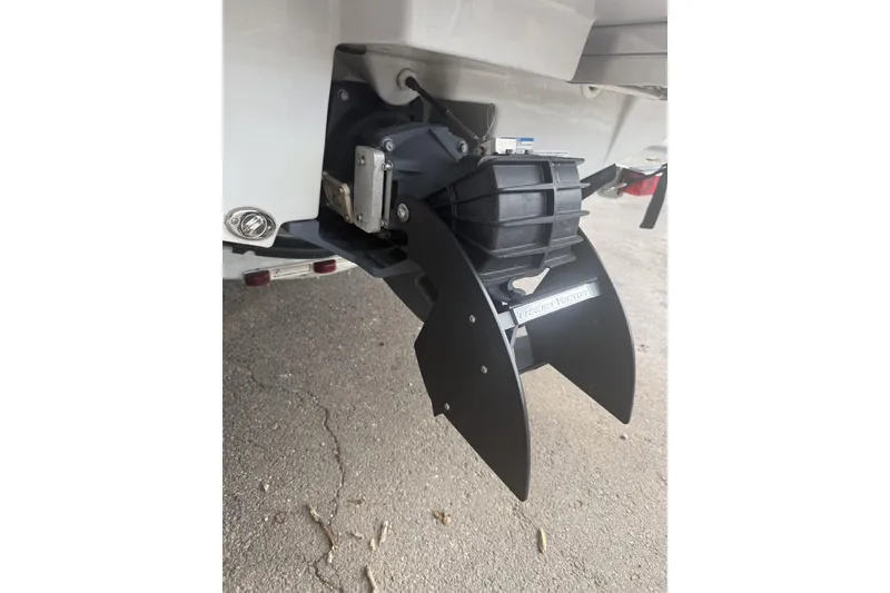 Slide: The Image of Rear view of 2025 Yamaha Boats 195S jet propulsion system on pavement. - 13