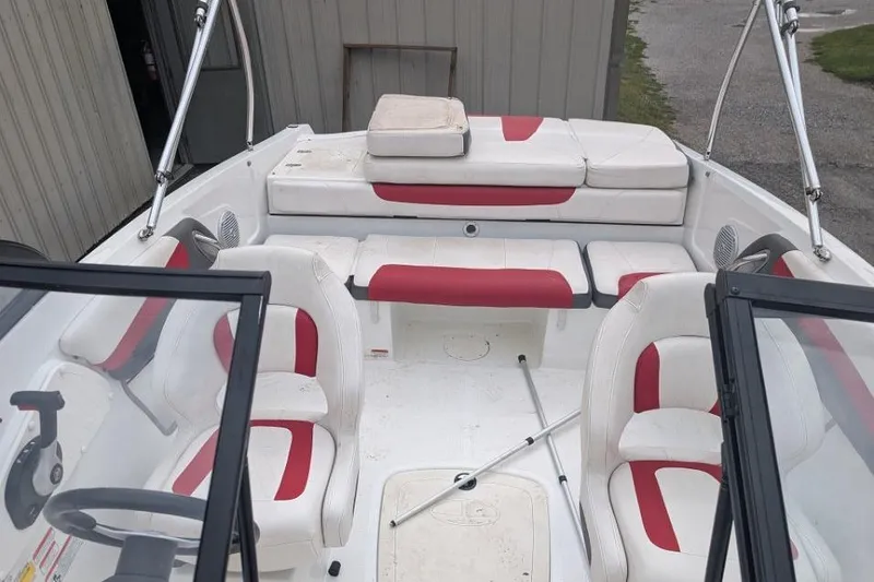 Slide: The Image of 2019 Tahoe 500 TF boat interior with red and white seating, open cockpit view. - 10