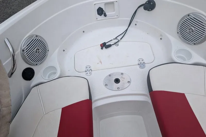 Slide: The Image of Interior of a 2019 Tahoe 500 TF boat with red and white seating. - 11