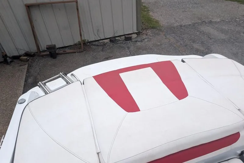 Slide: The Image of Rear view of a 2019 Tahoe 500 TF boat with white and red upholstery. - 12