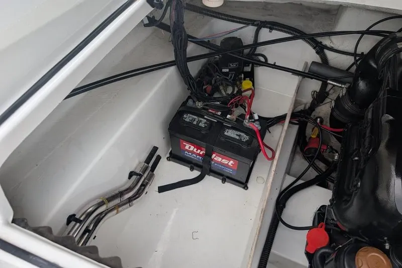 Slide: The Image of Engine compartment of a 2019 Tahoe 500 TF boat with battery and wiring. - 14