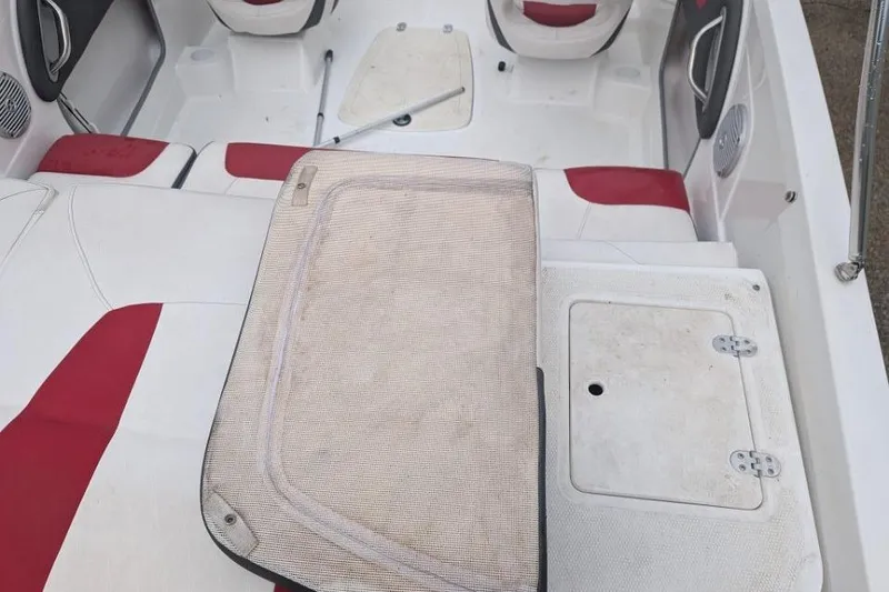 Slide: The Image of Interior of a 2019 Tahoe 500 TF boat with red and white seating. - 4