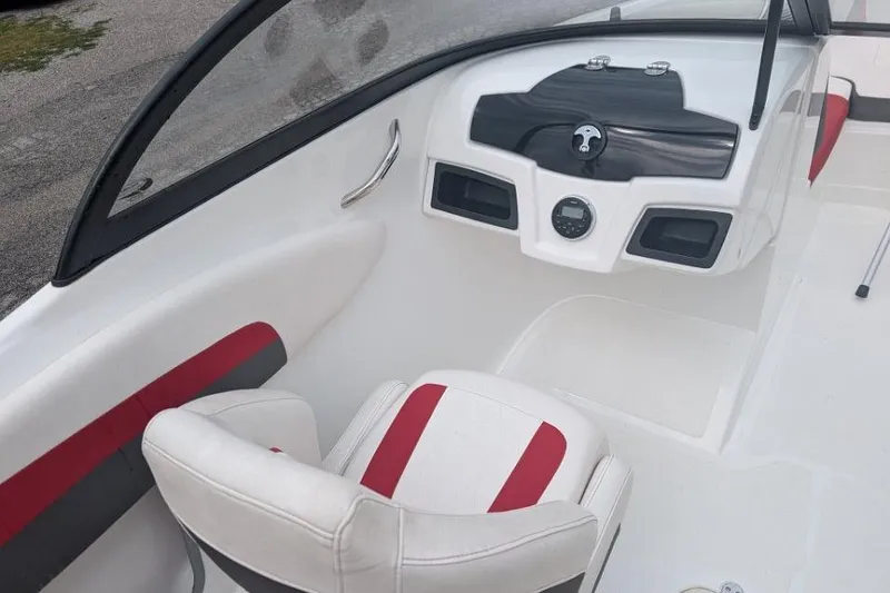 Slide: The Image of Interior of a 2019 Tahoe 500 TF boat with red and white seating. - 6