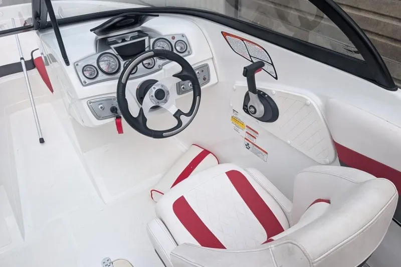 Slide: The Image of 2019 Tahoe 500 TF boat cockpit with steering wheel and control panel. - 7
