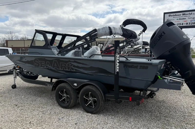 Slide: The Image of 2026 SeaArk ProCat 200 boat on trailer, featuring Suzuki outboard motor, parked outdoors. - 7