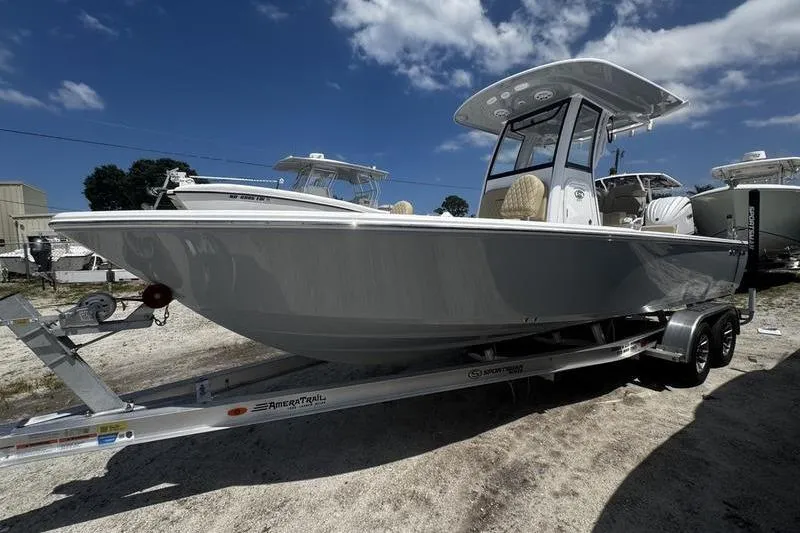 The Image of 2026 Sportsman Masters 247 Bay Boat on trailer under blue sky. - 1