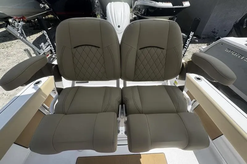 Slide: The Image of 2026 Sportsman Masters 247 Bay Boat seats with diamond stitching and armrests. - 11