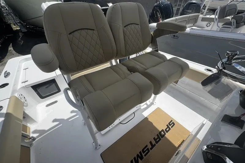 Slide: The Image of 2026 Sportsman Masters 247 Bay Boat with dual cushioned seats and armrests. - 14