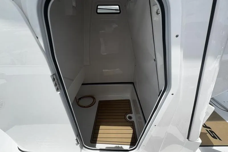 Slide: The Image of Interior view of 2026 Sportsman Masters 247 Bay Boat cabin with wooden flooring. - 15