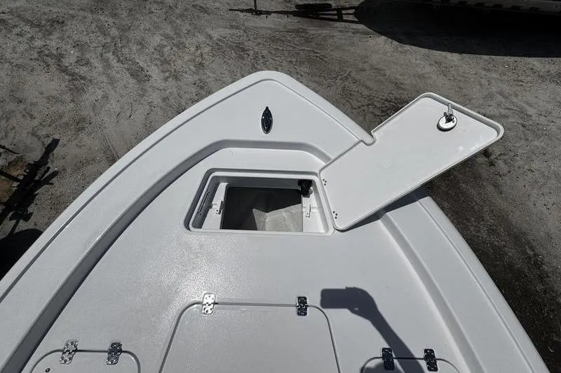 Slide: The Image of 2026 Sportsman Masters 247 Bay Boat bow with open storage compartment. - 20