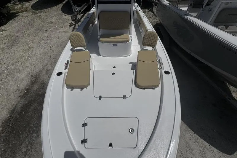 Slide: The Image of 2026 Sportsman Masters 247 Bay Boat with beige seating and spacious deck layout. - 22