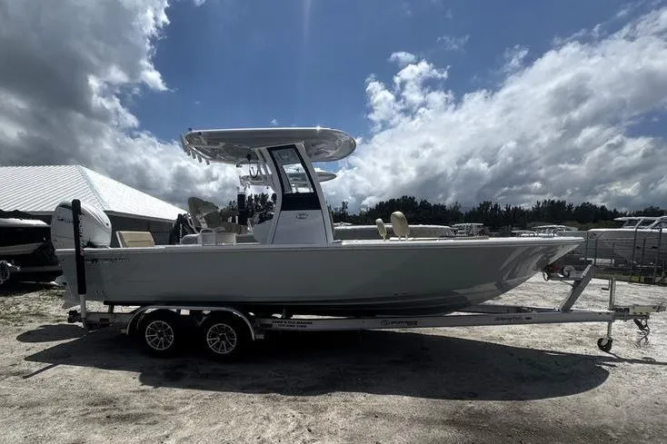 Slide: The Image of 2026 Sportsman Masters 247 Bay Boat on trailer under cloudy sky. - 24