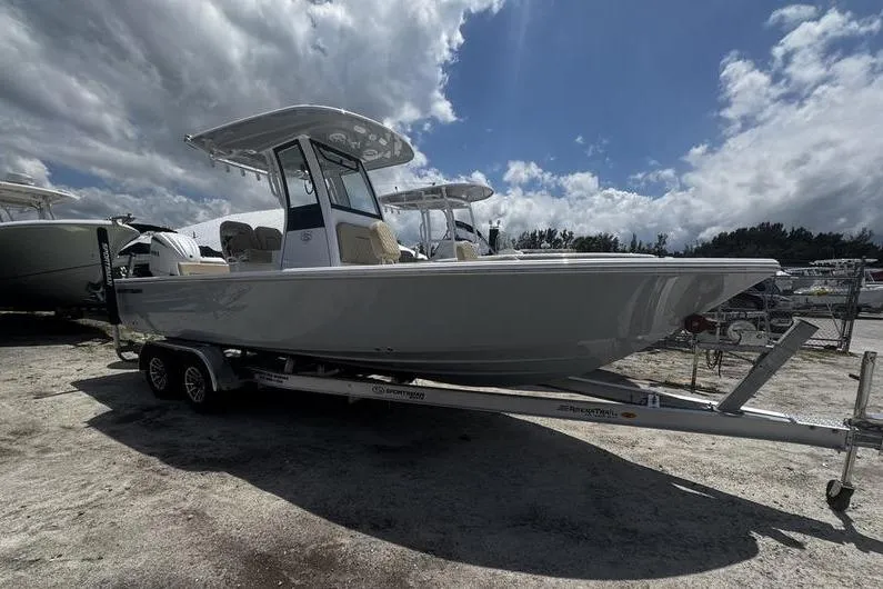 Slide: The Image of 2026 Sportsman Masters 247 Bay Boat on trailer under cloudy sky. - 27
