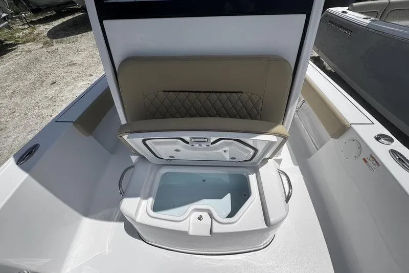 Slide: The Image of 2026 Sportsman Masters 247 Bay Boat interior with open storage compartment. - 5