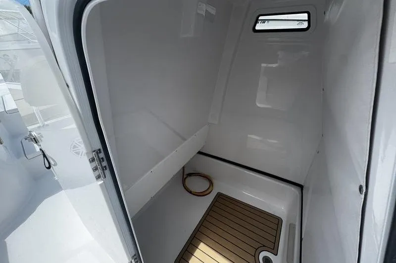 Slide: The Image of Interior cabin of 2026 Sportsman Masters 247 Bay Boat, featuring sleek design and wood flooring. - 6