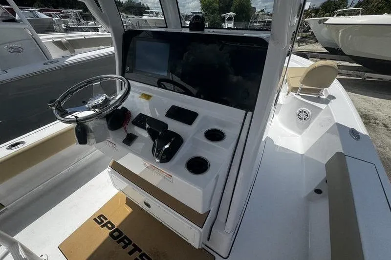 Slide: The Image of 2026 Sportsman Masters 247 Bay Boat cockpit with steering wheel and control panel. - 7