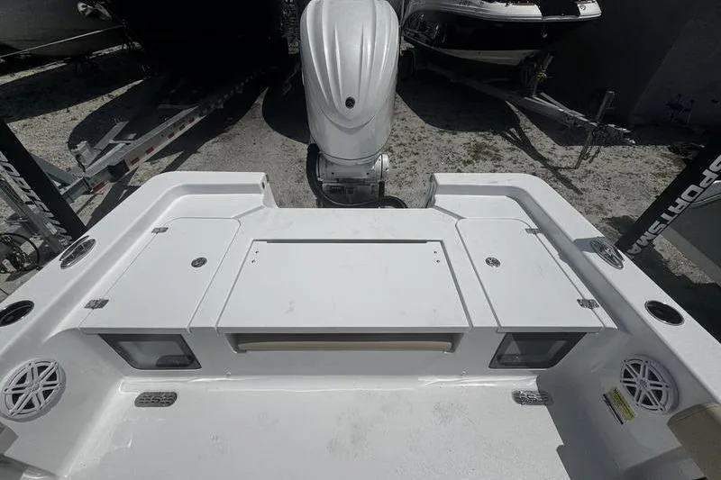 Slide: The Image of 2026 Sportsman Masters 247 Bay Boat deck with motor, showcasing spacious layout and storage. - 9