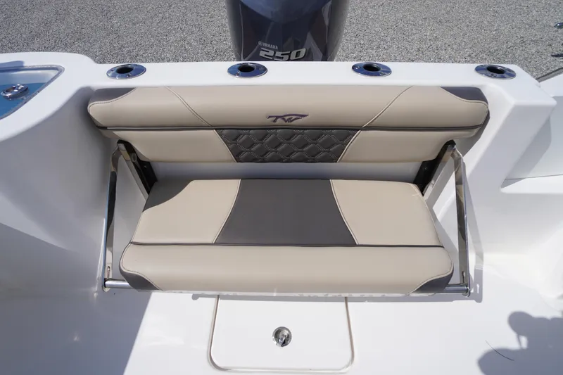 Slide: The Image of 2023 Tidewater 232 CC Adventure boat seat with beige and gray upholstery. - 12