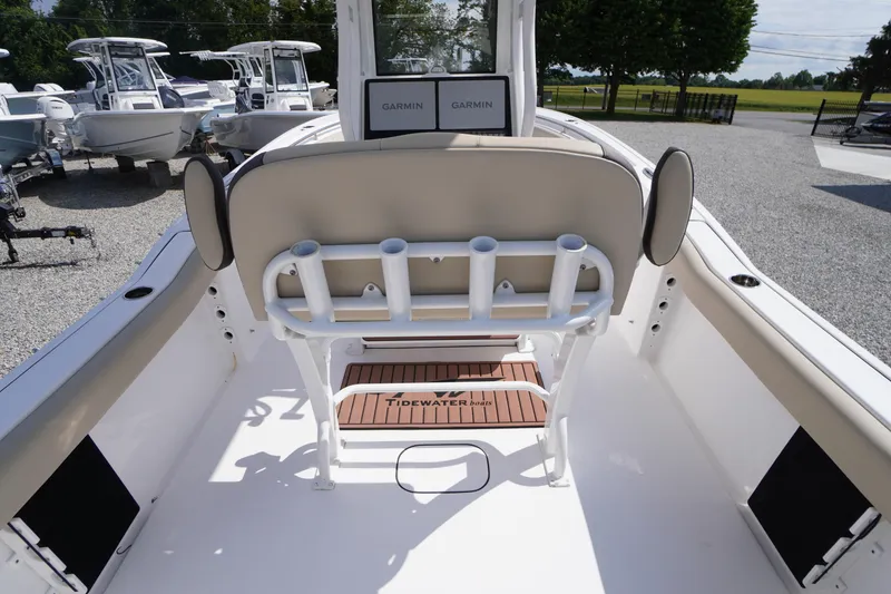 Slide: The Image of 2023 Tidewater 232 CC Adventure boat interior with rod holders and Garmin electronics. - 14
