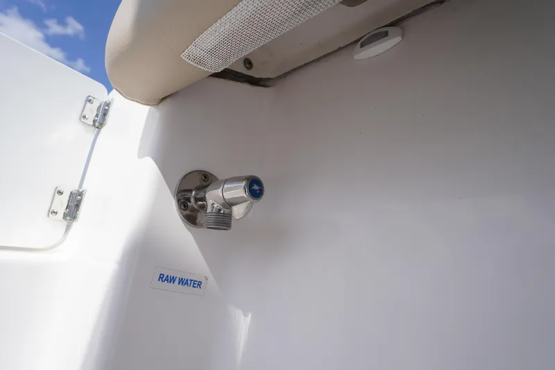Slide: The Image of 2023 Tidewater 232 CC Adventure boat raw water outlet detail. - 22