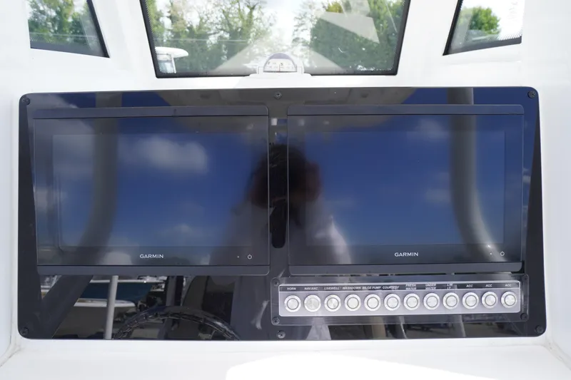 Slide: The Image of Dashboard of 2023 Tidewater 232 CC Adventure with dual Garmin displays and control panel. - 23