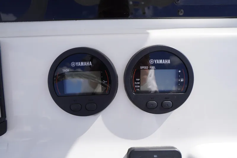 Slide: The Image of Yamaha gauges on 2023 Tidewater 232 CC Adventure boat dashboard. - 24
