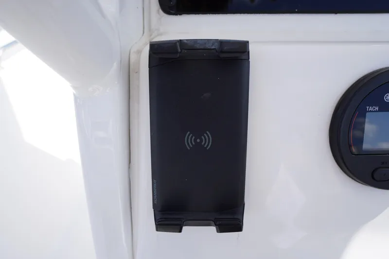 Slide: The Image of Wireless charging pad on 2023 Tidewater 232 CC Adventure boat dashboard. - 25