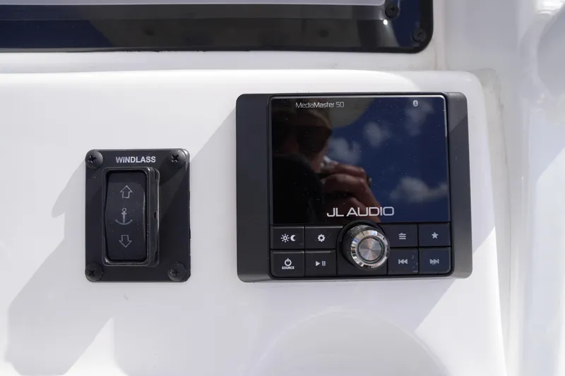 Slide: The Image of Control panel of 2023 Tidewater 232 CC Adventure with JL Audio system and windlass switch. - 26