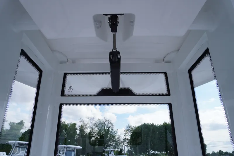 Slide: The Image of Interior view of 2023 Tidewater 232 CC Adventure boat, showcasing windows and ceiling details. - 30