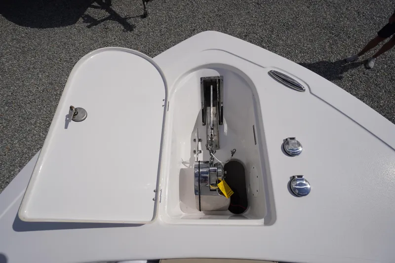 Slide: The Image of 2023 Tidewater 232 CC Adventure boat anchor compartment with open hatch. - 53