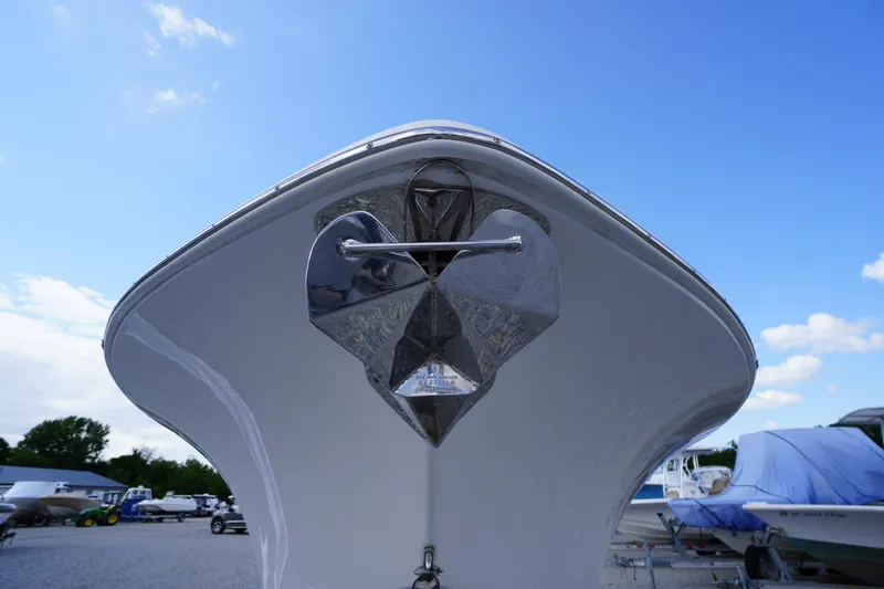 Slide: The Image of 2023 Tidewater 232 CC Adventure boat bow with anchor, under a clear blue sky. - 54