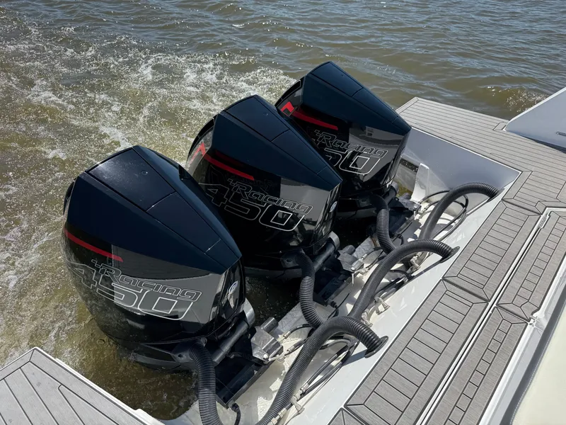 Slide: The Image of Three outboard engines on a 2021 Cruisers Yachts 38 GLS. - 17