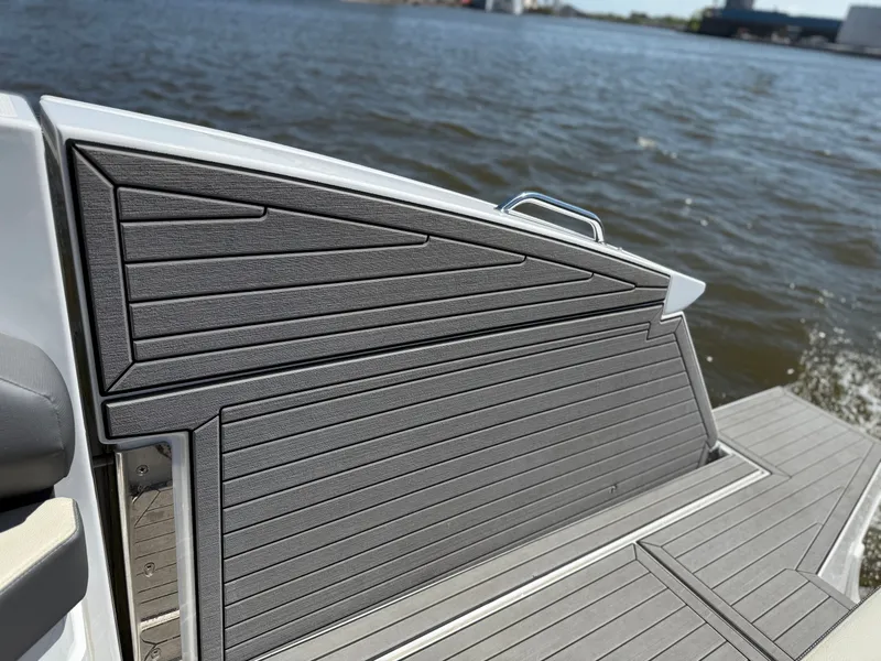 Slide: The Image of 2021 Cruisers Yachts 38 GLS, sleek deck design by the water. - 20