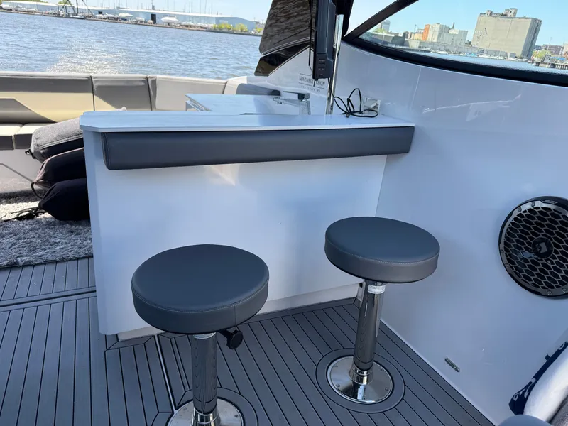 Slide: The Image of Interior of 2021 Cruisers Yachts 38 GLS with bar and stools. - 25