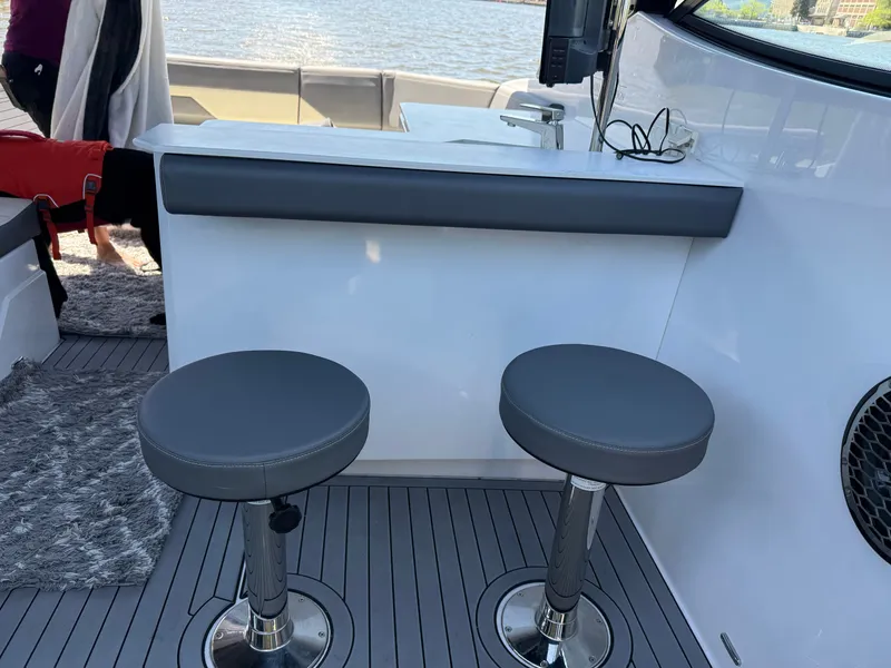 Slide: The Image of Interior of 2021 Cruisers Yachts 38 GLS with bar stools. - 29