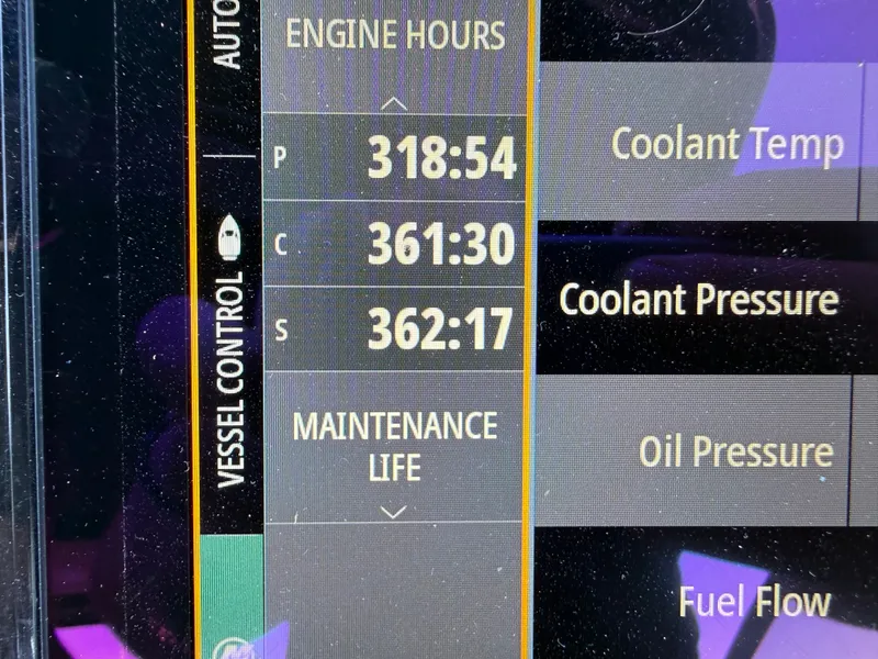 Slide: The Image of Display showing engine hours and maintenance data for 2021 Cruisers Yachts 38 GLS. - 35