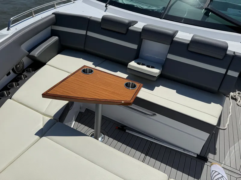 Slide: The Image of Interior of 2021 Cruisers Yachts 38 GLS with seating area and table. - 39