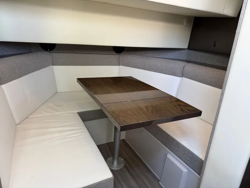 Slide: The Image of Interior of 2021 Cruisers Yachts 38 GLS with dining table and seating area. - 43