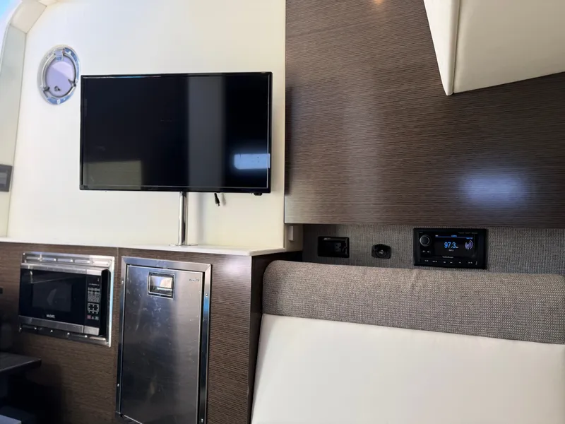 Slide: The Image of Interior of 2021 Cruisers Yachts 38 GLS with TV and microwave. - 49
