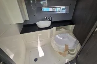 Slide: The Image of 2024 Navan S30 bathroom interior with modern sink and compact design. - 10