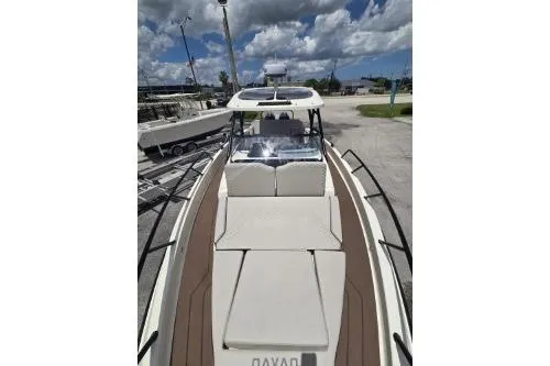 Slide: The Image of 2024 Navan S30 boat with sleek design, spacious deck, and modern features under a cloudy sky. - 6