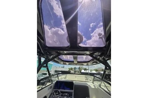 Slide: The Image of Interior view of 2024 Navan S30 boat with sunroof and clear sky. - 7