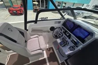Slide: The Image of 2024 Navan S30 boat cockpit with modern controls and dual screens. - 8