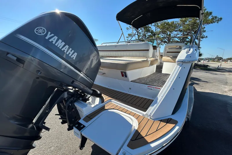Slide: The Image of 2018 Cobalt 25SC boat with Yamaha outboard motor, featuring spacious seating and sleek design. - 11