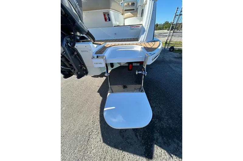 Slide: The Image of 2018 Cobalt 25SC boat stern with swim platform and outboard motor. - 12