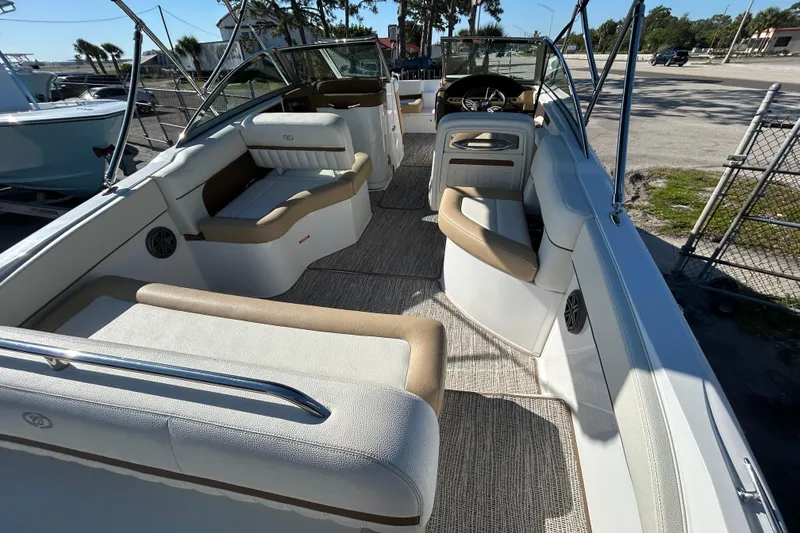 Slide: The Image of 2018 Cobalt 25SC boat interior with beige seating and modern design. - 14