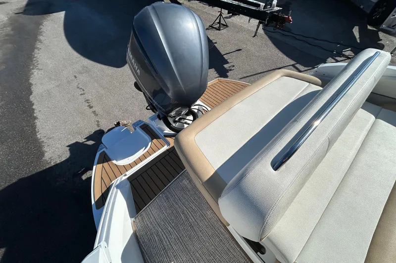 Slide: The Image of 2018 Cobalt 25SC boat with Yamaha outboard motor and cushioned seating. - 15