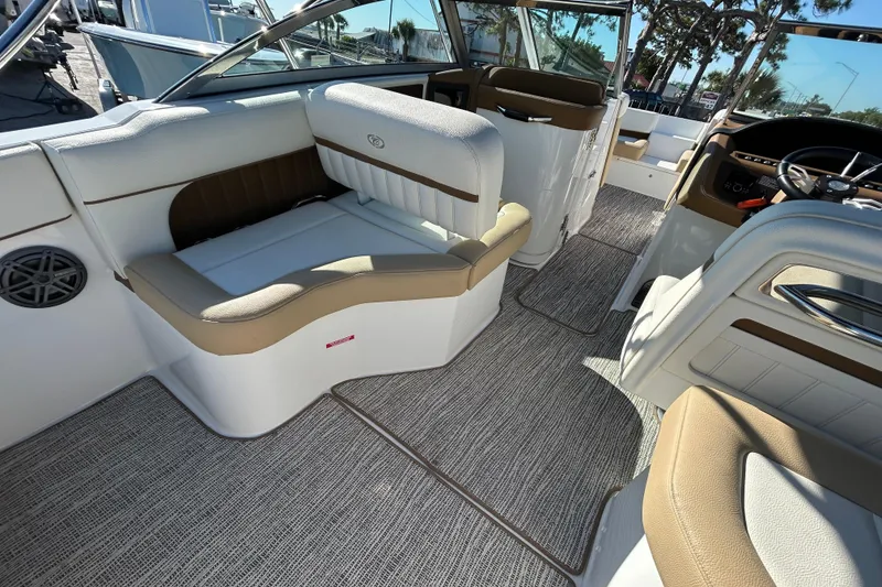 Slide: The Image of Interior of a 2018 Cobalt 25SC boat with luxurious seating and modern design. - 16