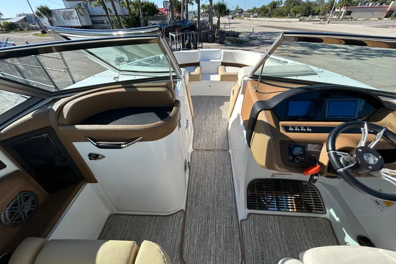 Slide: The Image of 2018 Cobalt 25SC boat interior with modern dashboard and seating. - 18