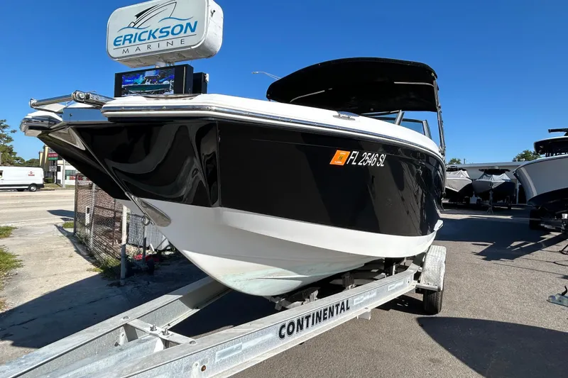 Slide: The Image of 2018 Cobalt 25SC boat on trailer at Erickson Marine dealership. - 2